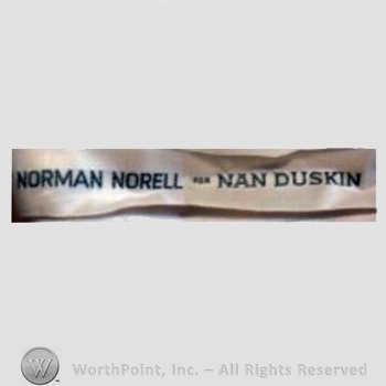 Clothing label : Norman Norell.