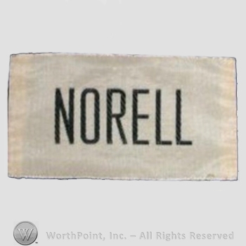 Clothing label : Norman Norell.