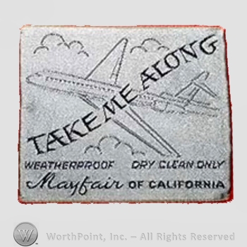 Clothing label : Novelty Label. Take me Along.