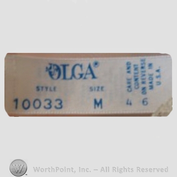 Clothing label : Olga Erteszek.