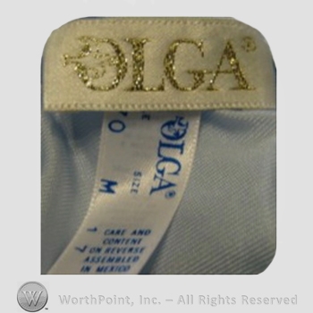 Clothing label : Olga Erteszek.