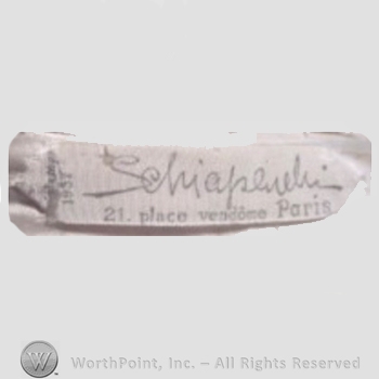 Clothing label : Elsa Schiaparelli.