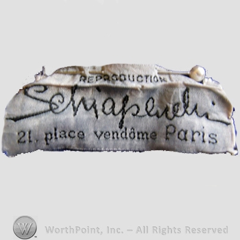 Clothing label : Elsa Schiaparelli.