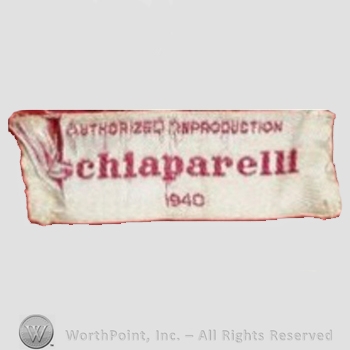 Clothing label : Elsa Schiaparelli.
