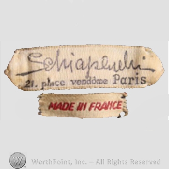 Clothing label : Elsa Schiaparelli.