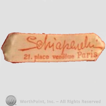 Clothing label : Elsa Schiaparelli.