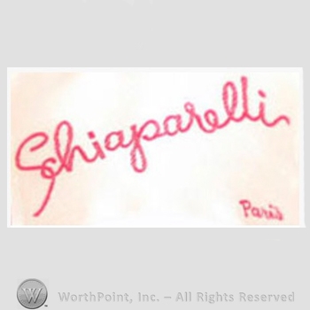 Clothing label : Elsa Schiaparelli.