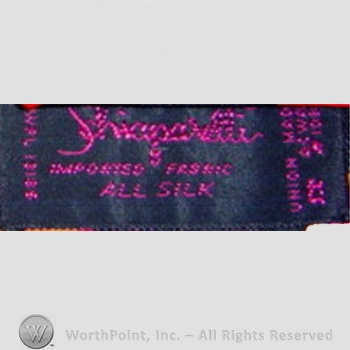 Clothing label : Elsa Schiaparelli.