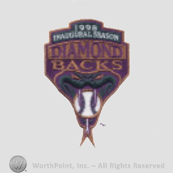 Arizona Diamondbacks sport logo: 1998 Inaugural Season written above Diamond Backs all above a snake biting a baseball.