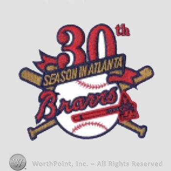 Atlanta Braves sport logo: 30th season in Atlanta Braves above a tomahawk, all on a baseball and crossed baseball bat.
