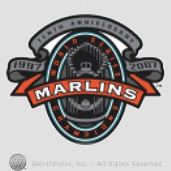 Miami Marlins sport logo: 1997 Tenth Anniversary 2007 written over an oval; Marlins written over, a crown and a baseball on the background.