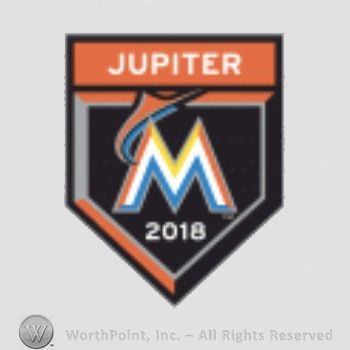 Miami Marlins sport logo: Jupiter written over a merlin leaping letter M.