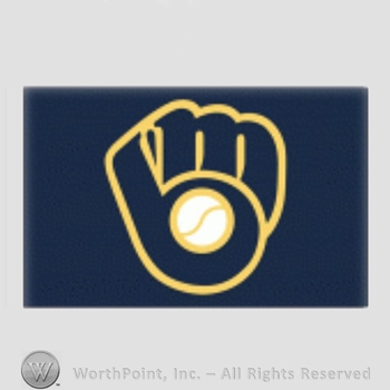 Milwaukee Brewers sport logo: MB together in the shape of a baseball glove on a navy blue background.