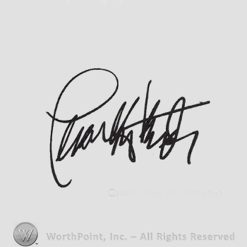 Signature: Charlton Heston.