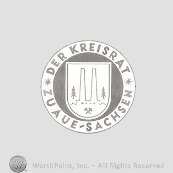 Heraldry: circle, shield, words, symbols of nature and industry.