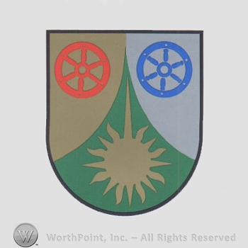Heraldry: two wheels, sun, shield.