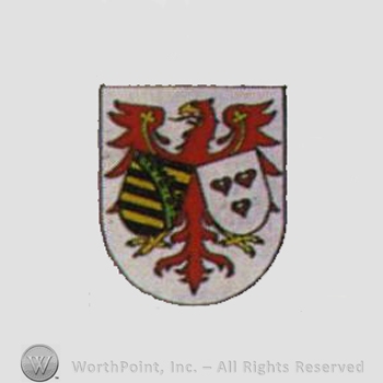 Heraldry: eagle, shields, hearts.