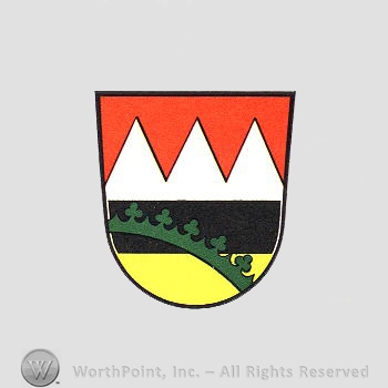 Heraldry: shield, dents, black line, ring and clover bar.