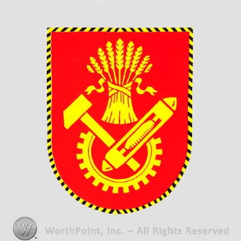 Heraldry: shield, wheat bunch, hammer, half gear wheel, shuttle.