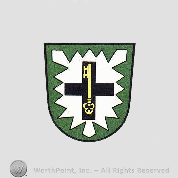 Heraldry: shield, leaf, cross, key.