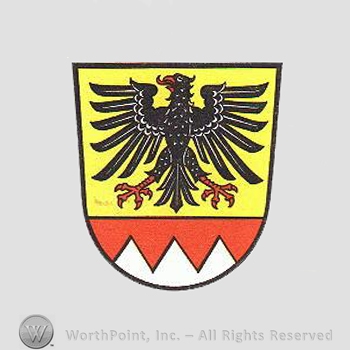 Heraldry: shield, eagle, dents.
