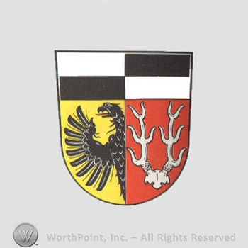 Heraldry: shield, eagle, antlers, chequered field.