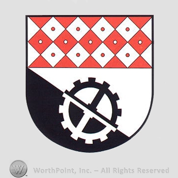 Heraldry: shield, cog wheel, small squares pattern.
