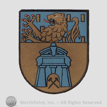 Heraldry: shield, lion, hammers, wavy line, gate.