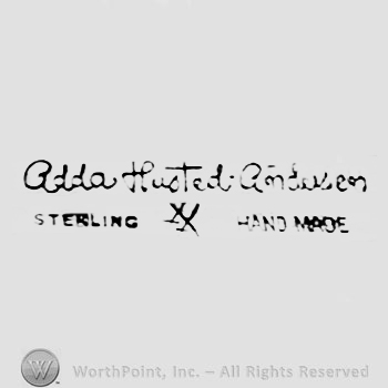 The text ''adda Husted andersen Sterling Handmade'' and two crosses.