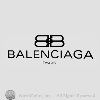 Two letters ''B'' placed back-to-back and connected with three diagonal lines and the text ''Balenciaga Paris''.