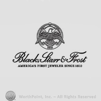 The text ''Black, Starr & Frost America's First Jeweler Since 1810'' and an eagle in a circle.