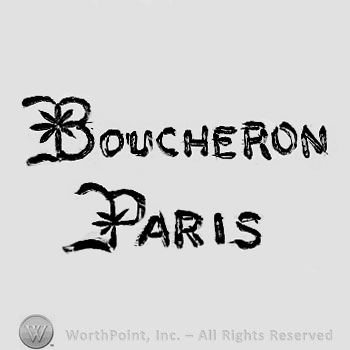 The text ''Boucheron - Paris'' and a flower.