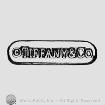 A border with the text ''Tiffany & Co.'' and the letter ''c'' in a circle.