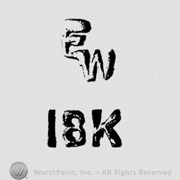 The monogram of the letters ''E'' and ''W'' and the text '' 18K''.