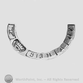 The text ''813H'' and ''N7'', an anvil, a crown and a triangle.