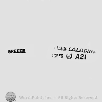 The text ''Ilias Lalaounis Greece'' and the numbers ''25'' and ''A21''.