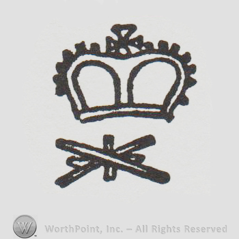 a crown above two lines that make an X