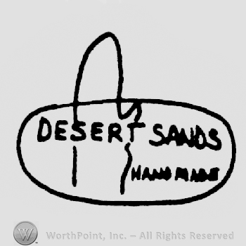 Desert Sand written above hand made all in oval shape frame with an cactus shape in it
