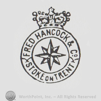 round logo with a star inside and a crown above and the text FRED HANCOCK & CO STOKE ON TRENT