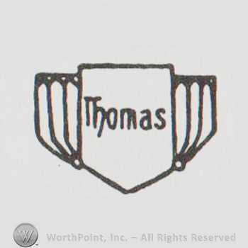 a shield with "thomas"