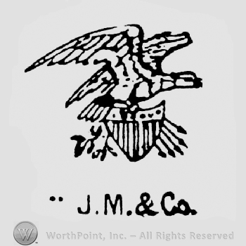 An eagle on a shield, above J.M.&Co. written