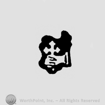 A hand grasping a cross