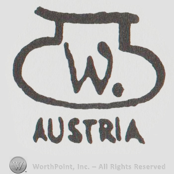 urn design with the letter W on it