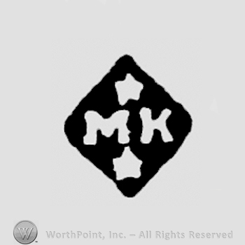 MK in lozenge