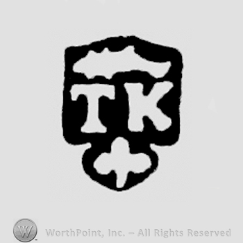 TK, fish above, trefoil below