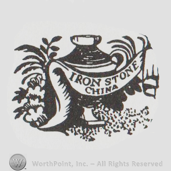 an urn, a banner that says IRONSTONE CHINA and some plants & flowers