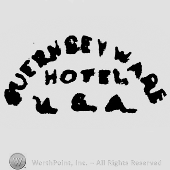Curved writing above Guernsey Ware, Hotel USA written under on two lines