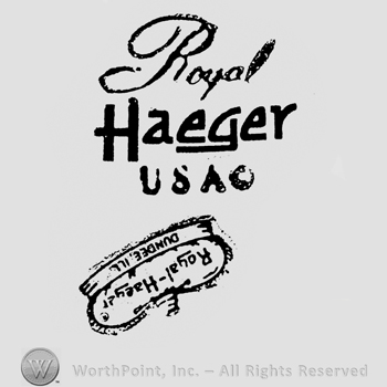 Above, on 3 lines is Royal italic written, bold capital Haeger, USA, on the bottom is an up side down crown with the writings on Royal Haeger, Dundee Ill