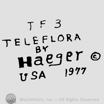 Written on 5 lines: T F 3 above, Teleflora under, By under, Haeger under, USA 1977 on the bottom