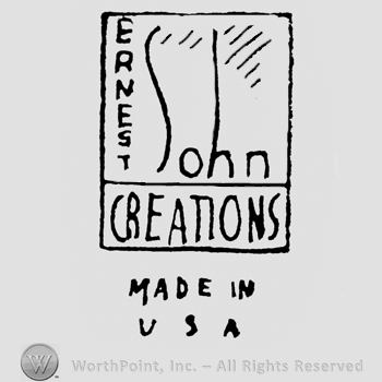 Inside a rectangle is written: Ernest on the vertical John on the horizontal, Creations under both, under the rectangle is written Made in USA